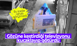 Gözüne kestirdiği televizyonu sırtlayıp götürdü, o anlar kameraya yansıdı