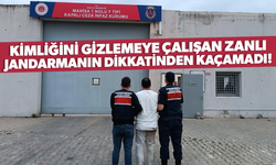 Kimliğini gizlemeye çalışan zanlı jandarmanın dikkatinden kaçamadı!