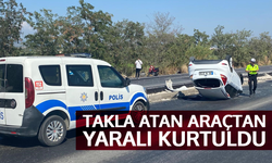 Takla atan araçtan yaralı kurtuldu