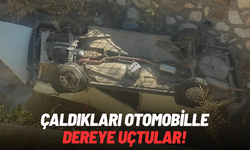 Çaldıkları otomobille dereye uçtular